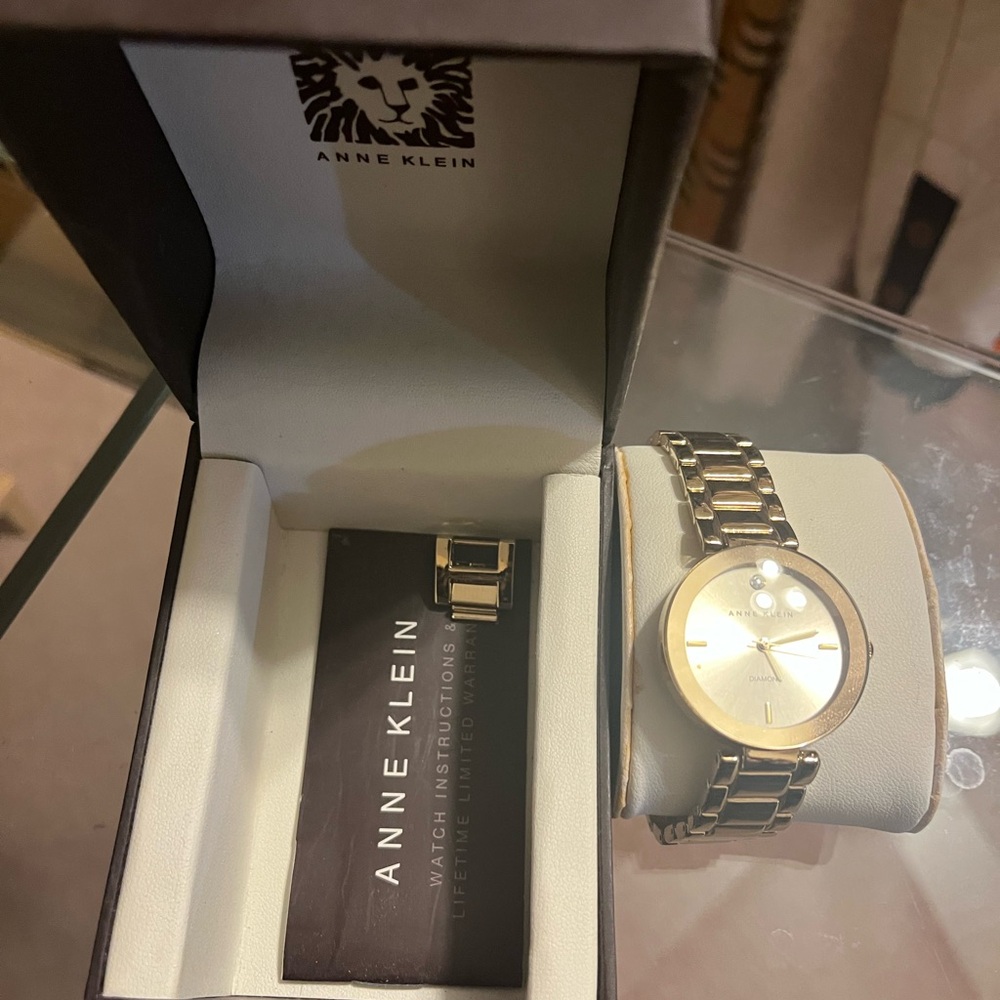 Authentic Anne Klein gold watch w/real diamond bezel at noon mark, no scratches